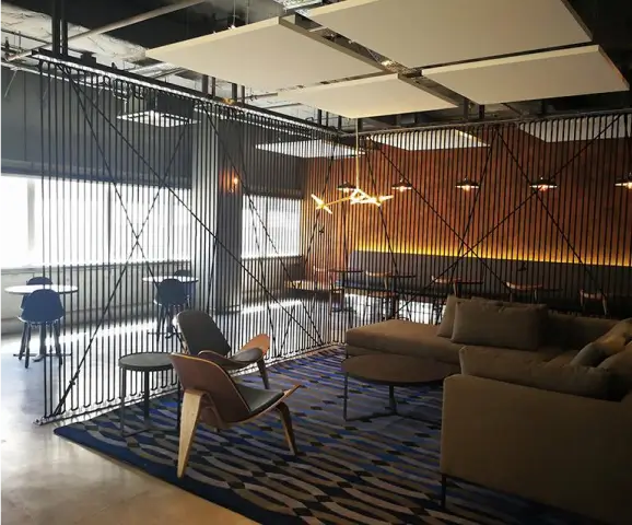 there is a room with a couch, chair, table and a television
