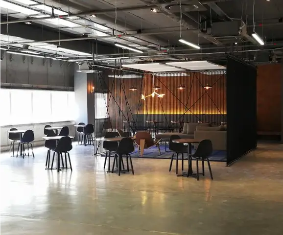 there is a room with a lot of chairs and tables