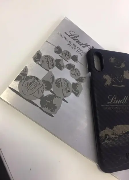 there is a book and a phone case sitting on a table