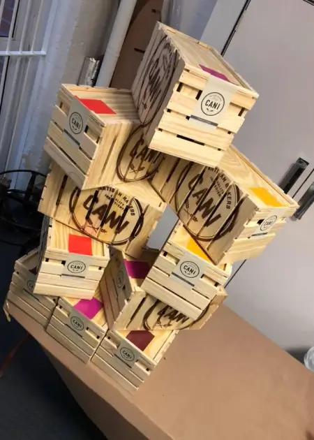 there is a stack of boxes with different colored papers on them