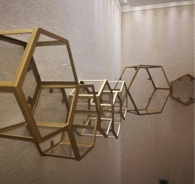 several hexagonal shelves are hanging on the wall in a room
