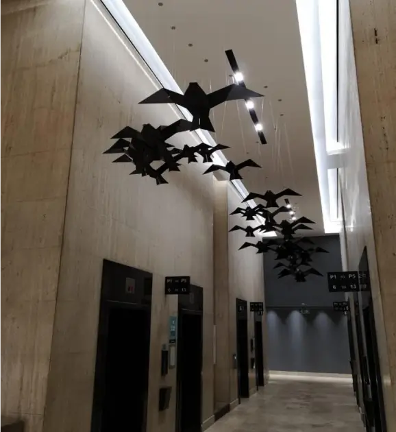 there are many birds that are flying in the air