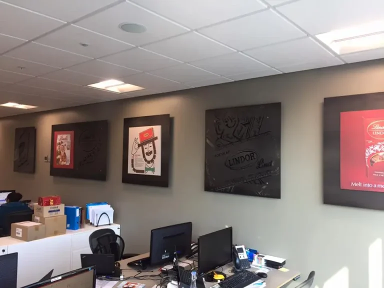 there are many pictures on the wall of a business office