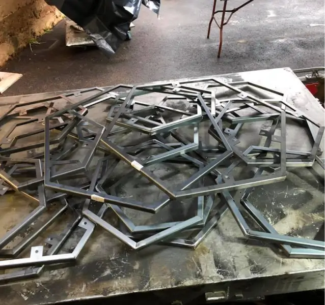 a close up of a pile of metal pieces on a table