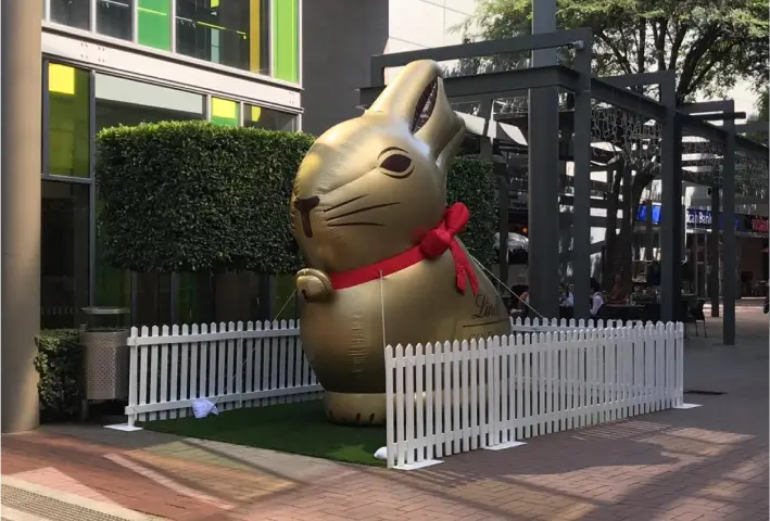 there is a giant inflatable bunny statue in the middle of a street