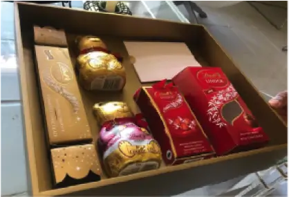 there is a box of chocolates and a box of candy