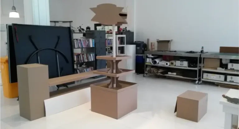 there is a cat sitting on a box in a room