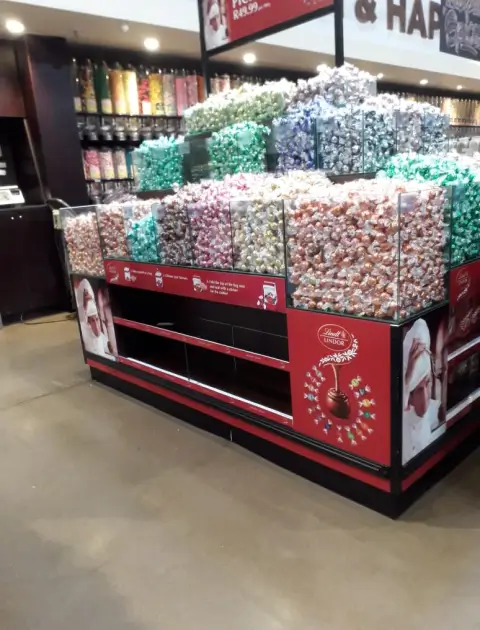 arafed display of candy in a store with a variety of candies