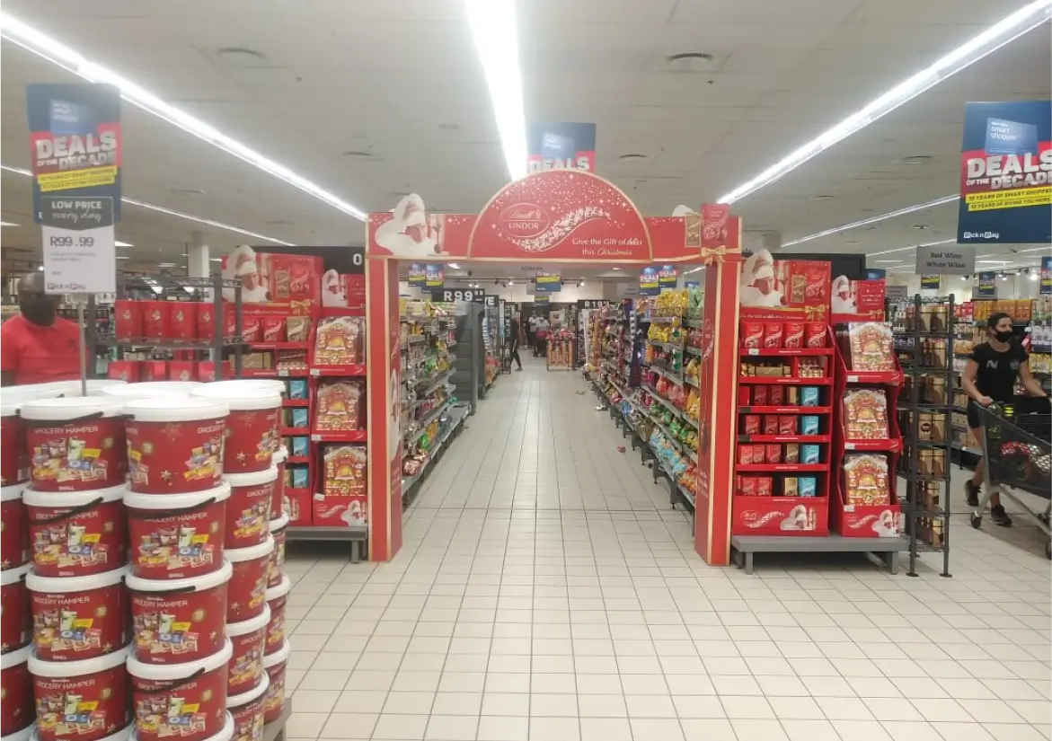 arafed aisle of a store with a variety of products on display