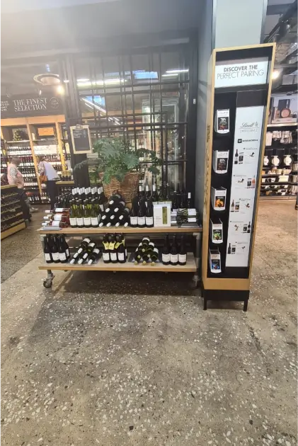 a close up of a display of wine bottles in a store