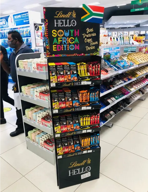 a close up of a store with a shelf of food and people