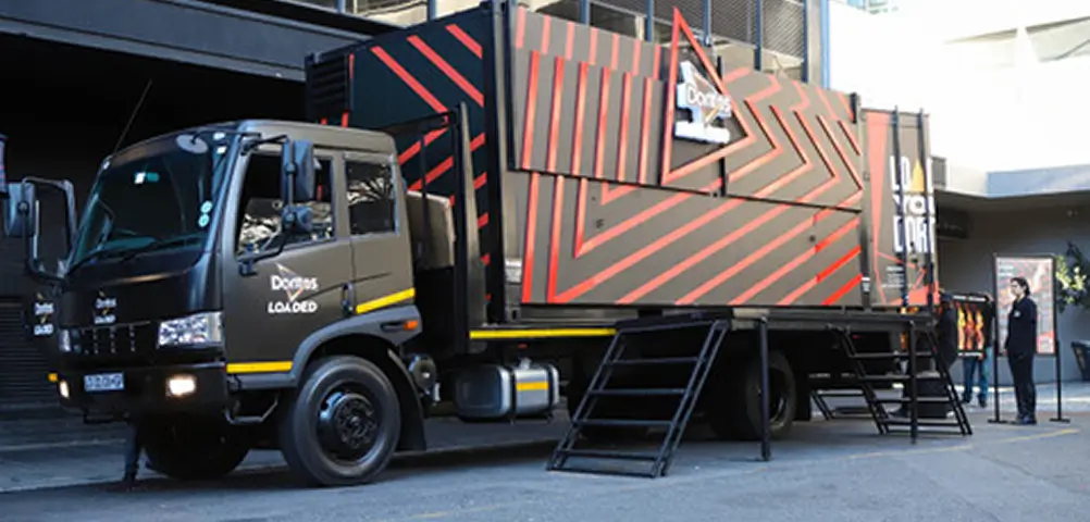 there is a truck that is parked in front of a building
